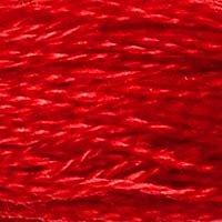 Close up of DMC stranded cotton shade 666 Bright Red