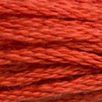 Close up of DMC stranded cotton shade 900 Saffron Orange