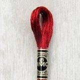 Close up of DMC stranded cotton shade 321 Red Ruby