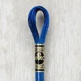 Close up of DMC stranded cotton shade 825 Blue Sapphire