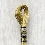 Close up of DMC stranded cotton shade 3821 Light Gold
