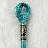Close up of DMC stranded cotton shade 3849 Aquamarine Blue
