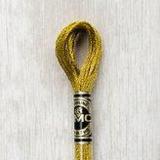 Close up of DMC stranded cotton shade 3852 Dark Gold